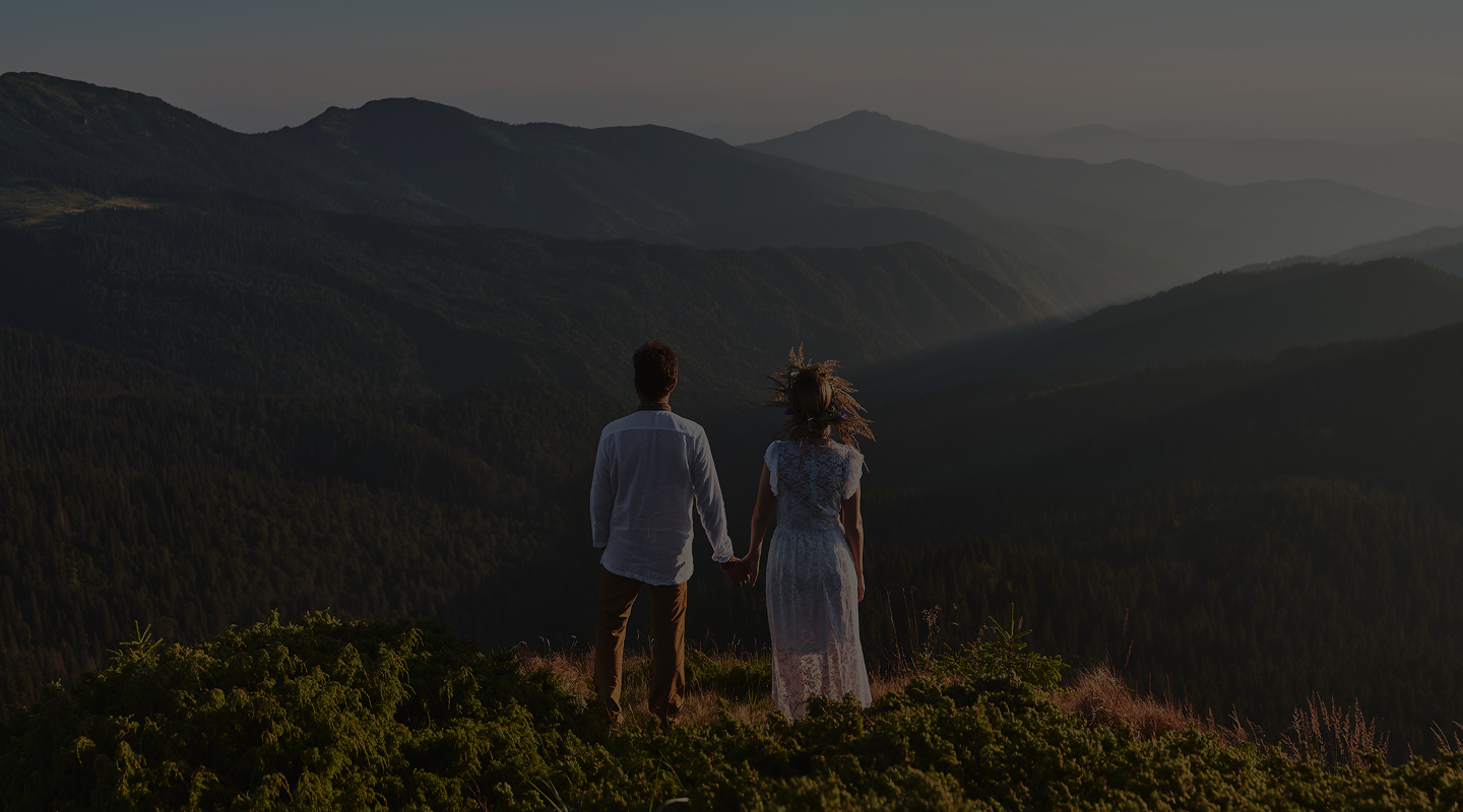 young-couple-love-standing-grassy-hill-mountains 1 (1)